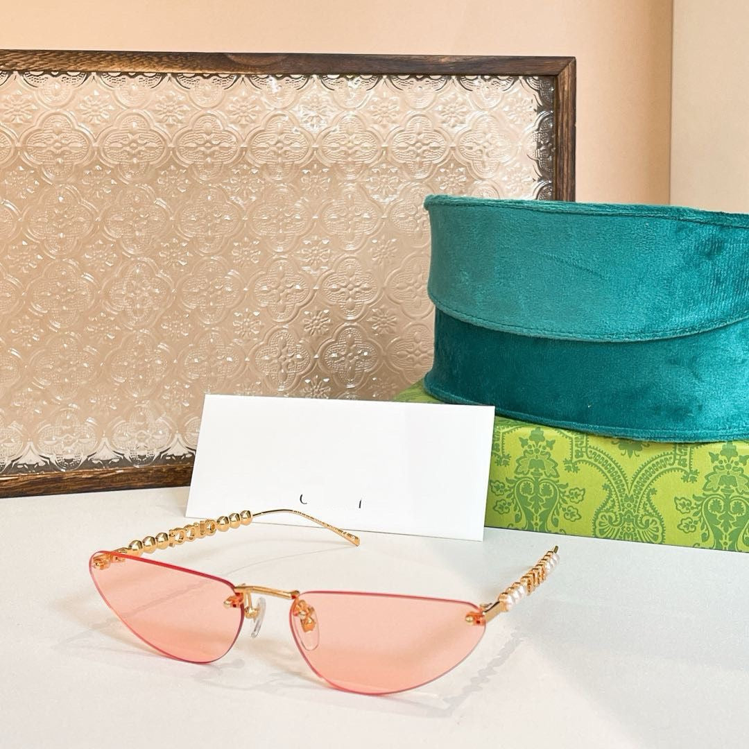 Gucci Oval Sunglasses with Pearl and Chain Detail