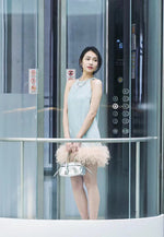 Chic Denim Mini Dress with Feather Hem